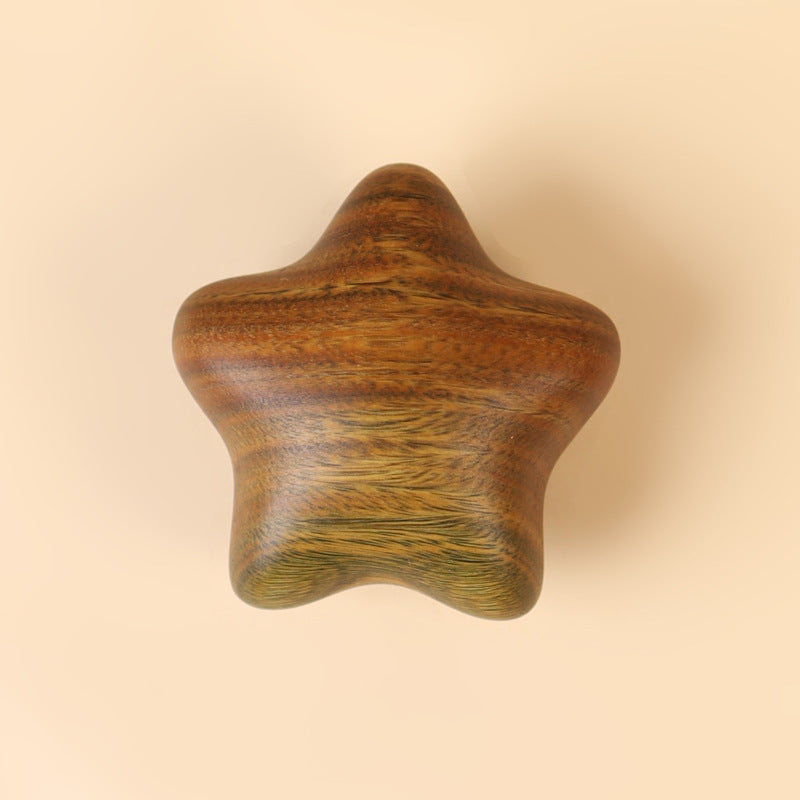 Wabi-sabi style wooden moon and star keepsake in soft natural light