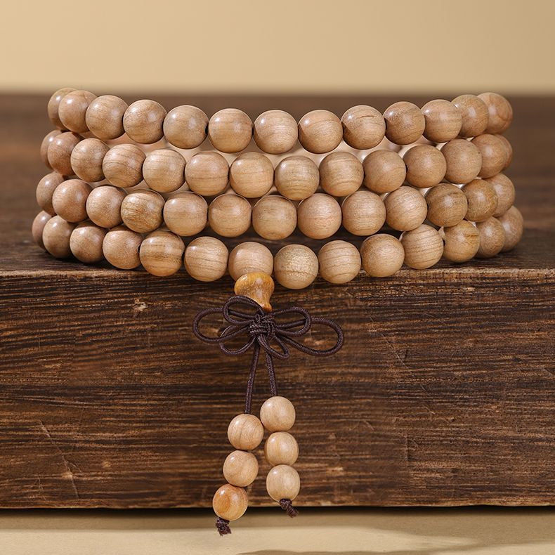 Xigura Patina handcrafted sandalwood wood bracelet, daily ritual scene for a warm, quiet home.