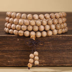 Xigura Patina handcrafted sandalwood wood bracelet, daily ritual scene for a warm, quiet home.