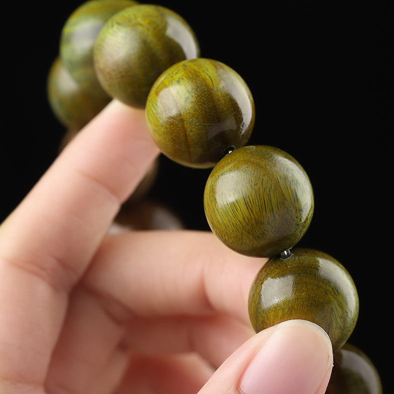 Xigura Patina handcrafted sandalwood bookmark, thoughtful gift presentation for a warm, quiet home.