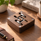 Black walnut cufflink organizer with divided slots for storing cufflinks and other small accessories.