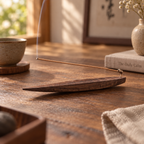 Black walnut incense tray showing the natural wood grain and long tapered shape.
