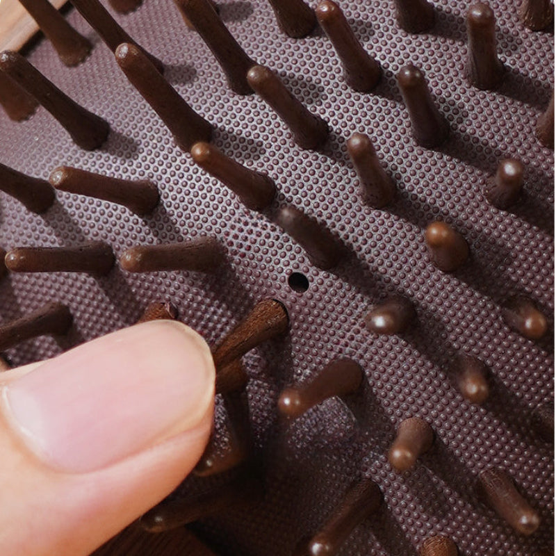 Black walnut wooden hair brush shown with a size guide for product scale and proportions.