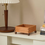 Close-up of natural cherry wood grain and handcrafted details on a catchall tray