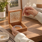 Cherry wood jewelry box with a decorative transparent lid for storing necklaces, bracelets, and small keepsakes.