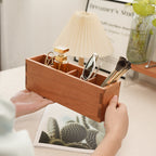 Cherry wood storage box with divided compartments for organizing everyday essentials.