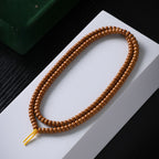 Xigura Patina handcrafted olive wood bracelet, natural grain detail for a warm, quiet home.