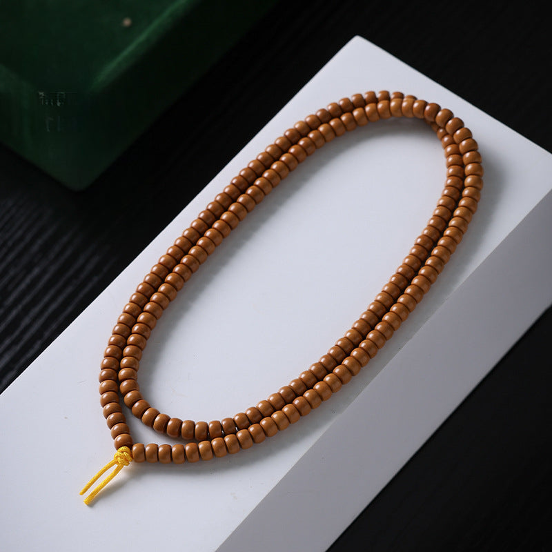 Xigura Patina handcrafted olive wood bracelet, natural grain detail for a warm, quiet home.