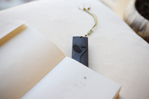 Xigura Patina handcrafted ebony bookmark, natural grain detail for a warm, quiet home.