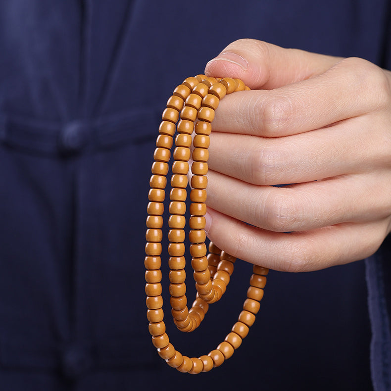 Xigura Patina handcrafted olive wood bracelet, thoughtful gift presentation for a warm, quiet home.
