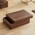 Xigura Patina handcrafted black walnut storage box, main view in soft natural light for a warm, quiet home.
