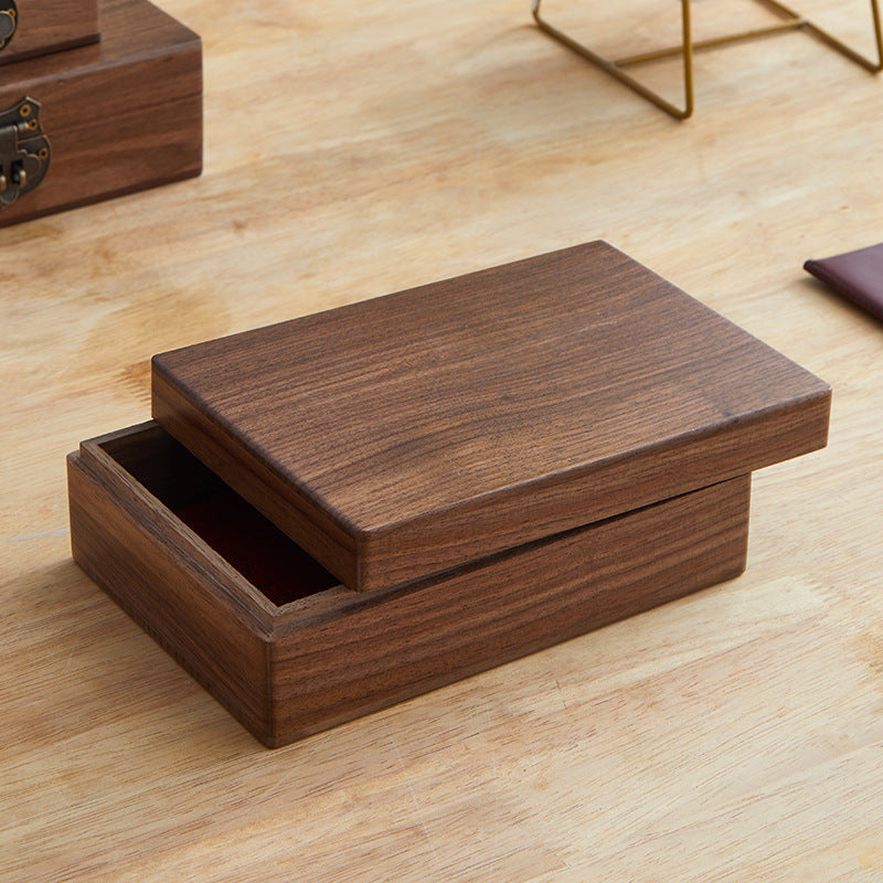 Xigura Patina handcrafted black walnut storage box, main view in soft natural light for a warm, quiet home.