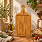 Olive wood serving board showing the distinctive natural grain and smooth handcrafted surface.