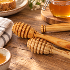 Personalized olive wood honey dipper with engraved text, designed as a charming kitchen accessory or gift.