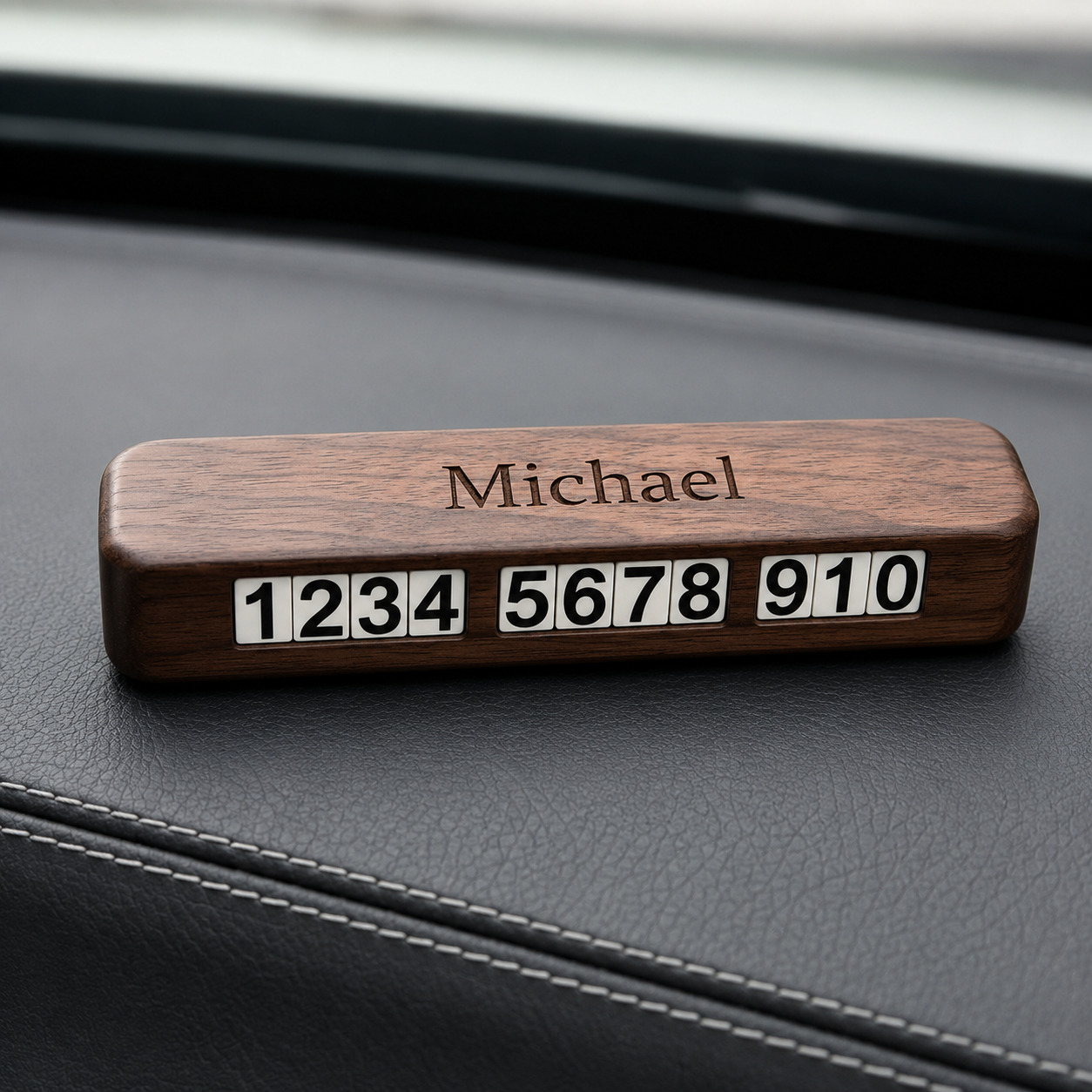 Personalized wooden temporary parking phone number plate with engraved name and adjustable contact numbers for car dashboard use.