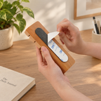Wall-mounted cable management organizer with individual wooden slots for keeping cords separated.