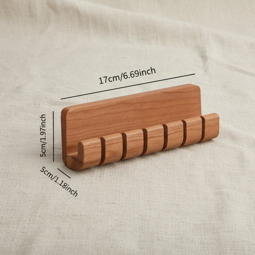 Wooden cable organizer shown with a size guide for product scale and proportions.