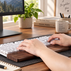 Wooden keyboard wrist support made from black walnut for a clean and comfortable workspace.