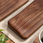 Wooden mouse wrist rest styled on a desk beside a notebook and coffee mug for everyday workspace use.