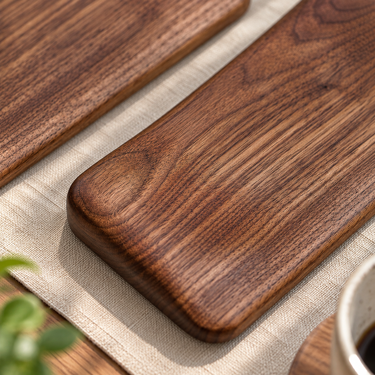 Wooden mouse wrist rest styled on a desk beside a notebook and coffee mug for everyday workspace use.